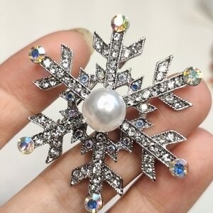 Elegant Silver Snowflake Brooch with Pearl Center
